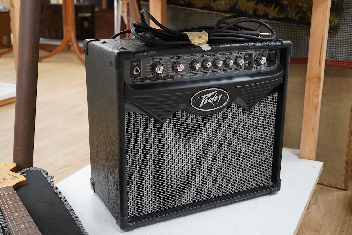 A Fender Squire electric guitar, with a Kinsman soft case, together with a Peavey VYPYR 15W modelling amplifier